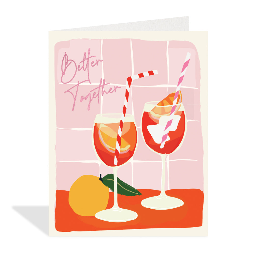 Greeting card design by Canadian Artist, Rachel Joanis. A cute illustration of two fruit cocktail glasses with stripe straws and a pink foil sentiment that reads, "better together". 