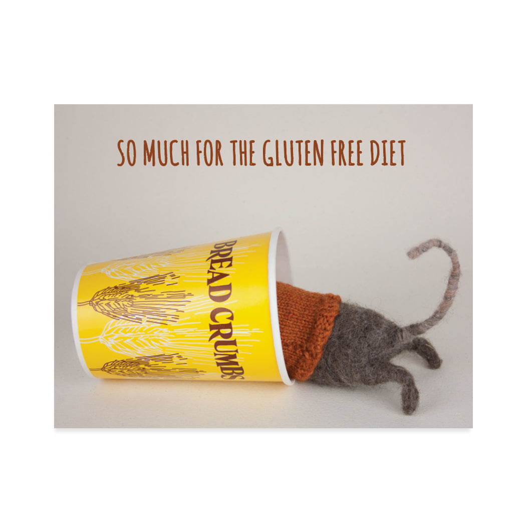 Greeting card design created by Canadian artist, Claudine Crangle. A cute image of a felted mouse inside a bread crumbs cup. A sentiment that reads "so much for the gluten free diet".