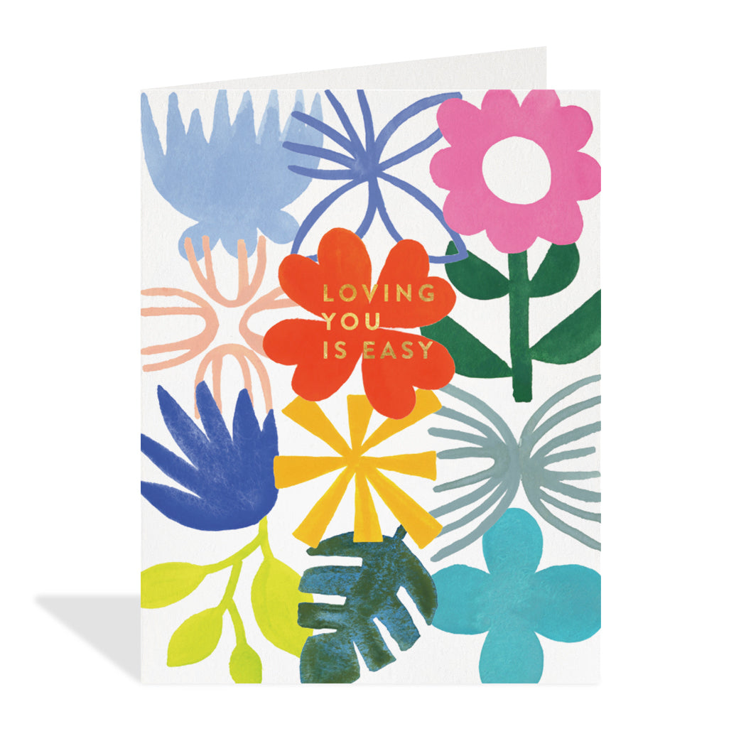 Greeting card design by Cassandra Ott. A colorful floral abstract design with a gold foil sentiment that reads "loving you is easy".